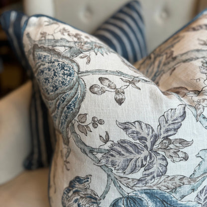 Indulge in the beauty of nature with this exquisite floral cushion by P Kaufmann Fabric House. Featuring a captivating double-sided navy and light blue floral pattern against a luxurious ivory backdrop, accented by navy linen piping from Westbury Fabrics. And for that perfect finishing touch, it comes with a feather insert for unparalleled comfort.