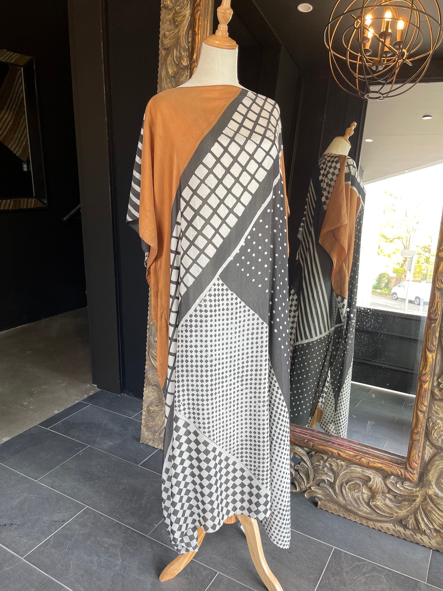 Designed by esteemed Indonesian designer Warwick Purser, this beautiful Kaftan showcases a special pattern printed by hand using the traditional Batik printing methods of East Indonesian villages. Crafted from breathable bamboo, providing lightweight comfort while making it perfect for warmer climates and travelling.