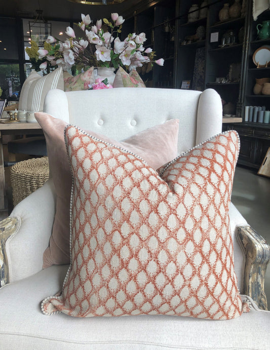 This elegant Cypress Block Printed Linen Rust Cushion is hand block printed on soft, natural linen and adorned with delicate piping along the edges. Drawing inspiration from the luxurious textiles of the ancient Orient, it adds a touch of sophistication to any space. Crafted by the renowned Swedish brand, Chamois, this cushion is made with premium Belgian 100% linen and includes a soft feather insert.