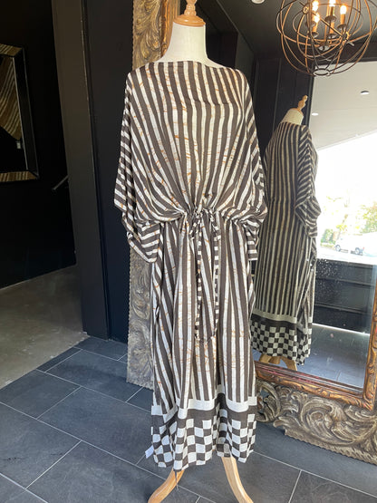 Designed by esteemed Indonesian designer Warwick Purser, this beautiful Kaftan showcases a special pattern printed by hand using the traditional Batik printing methods of East Indonesian villages &amp; complete with a drawstring is perfect for cinching at the waist. Crafted from breathable bamboo, providing lightweight comfort while making it perfect for warmer climates and travelling.