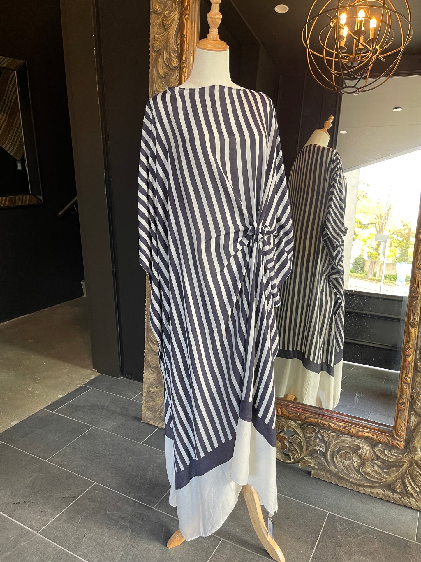 Designed by esteemed Indonesian designer Warwick Purser, this beautiful Kaftan showcases a special pattern printed by hand using the traditional Batik printing methods of East Indonesian villages. Crafted from breathable bamboo, providing lightweight comfort while making it perfect for warmer climates and travelling.