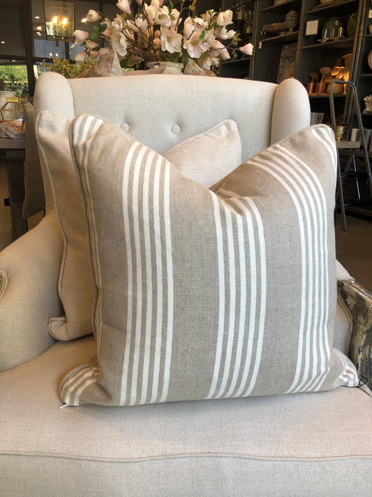 Indulgently fashioned from a luxurious, durable fabric, this exquisite Wortley White Stripe Beige Cushion boasts classic white stripes on a warm neutral background. It's the perfect timeless and graceful accent to elevate any home decor. Includes a luxurious feather insert.