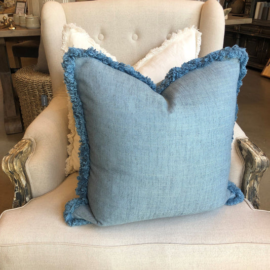 Indulge in the superior comfort of Warwick Fabrics heavyweight textile, found in this luxurious Husk Amalfi Blue Brush Fringe Cushion. Its sumptuous blue hue is enhanced with a brush fringe, adding exquisite texture and flair. Enjoy the snuggly embrace of its luxurious feather insert.