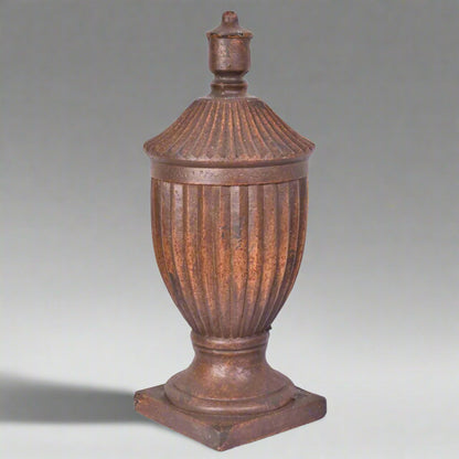 Decorative urn with a lid on a white background