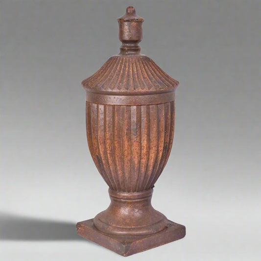 Decorative urn with a lid on a white background