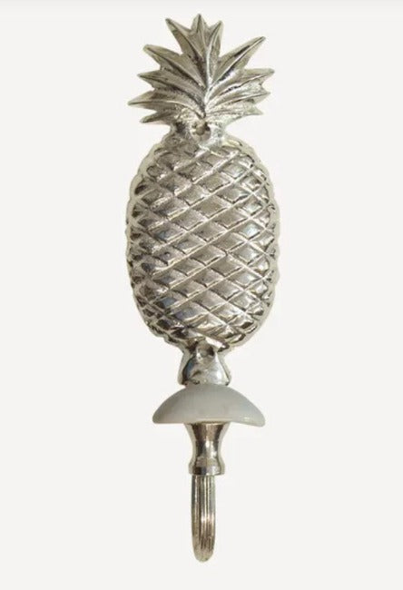 Elevate your home decor with our elegant Silver Pineapple Hook. Perfect for any space, whether it's the entryway, hallway, or bedroom, this charming and functional hook is crafted from high-quality brass and exquisitely finished in silver. 