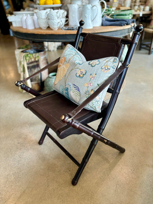 Designed with a dark brown teak frame, the Sentai Folding Leather Chair features vintage brass details and a beautiful leather back and seat. You can easily fold the chair by lifting the seat so you can store it away when not in use. Front