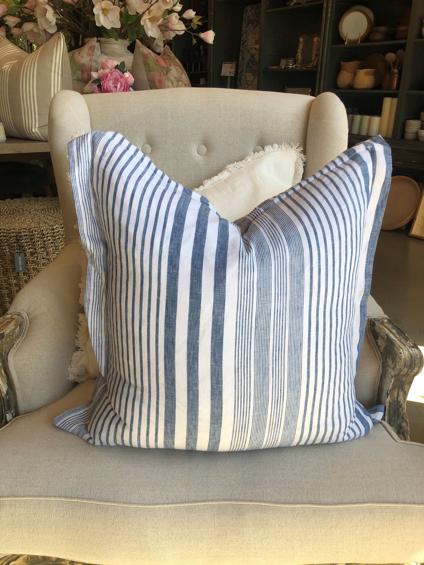 Experience the luxurious comfort and stylish design of the Joie De Vivre French Linen Blue White Stripe Cushion. Made with strong, hypo-allergenic yarn-dyed fabric, our cushions feature a vibrant color that won't fade. Each cushion is filled with a high-quality plush feather insert for maximum comfort. Elevate your home decor with our irresistible cushion.