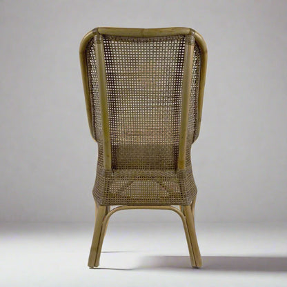 Wicker chair with a textured backrest on a plain background