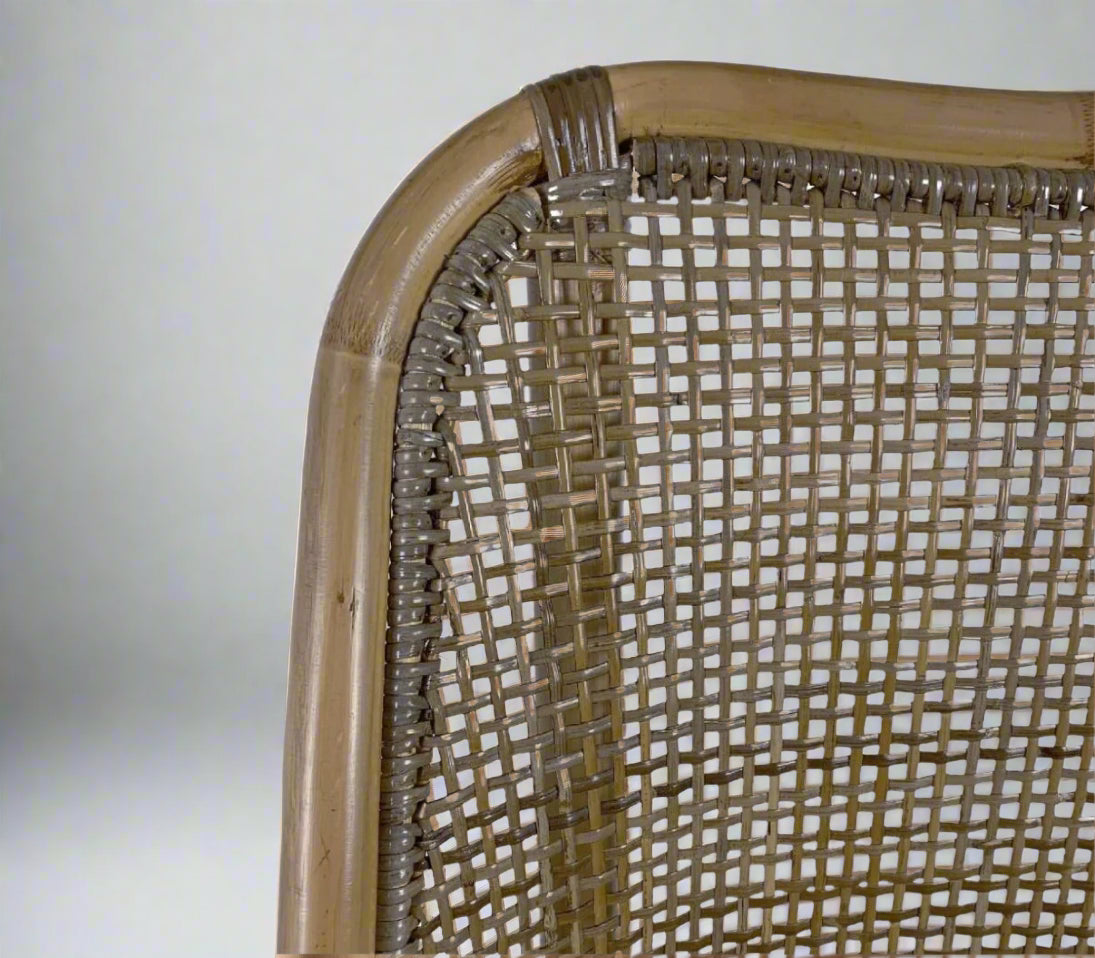 Close-up of a wicker chair back with a white background