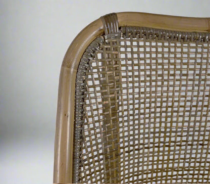 Close-up of a wicker chair back with a white background