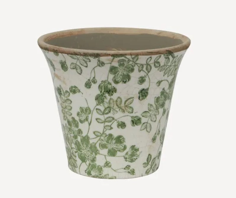 Immerse yourself in the rejuvenating essence of nature with the Green Botanical Print Fluted Pot. Made from stoneware and embellished with a stunning botanical design, this pot adds a touch of natural beauty to any indoor or outdoor area. Infuse your space with a burst of freshness and vitality by adding this pot to your decor.