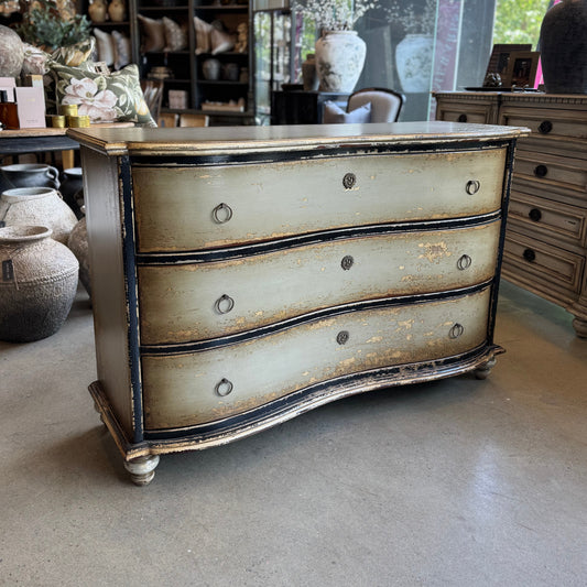 Vintage-style dresser in a room with decorative elements