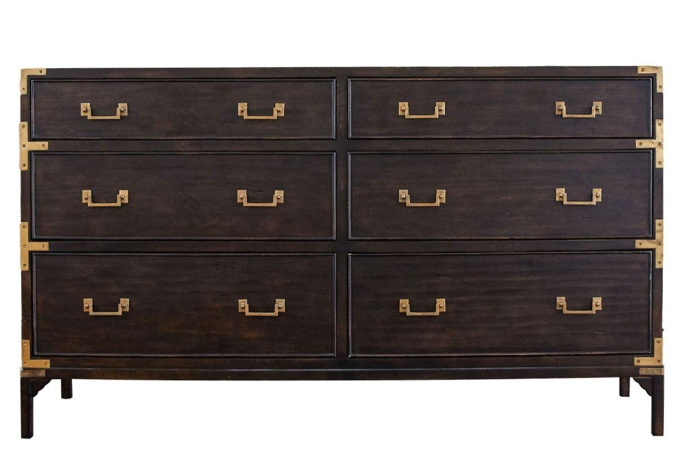 A dark brown wooden six-drawer dresser with brass hardware and corner guards, shown against a plain white background.