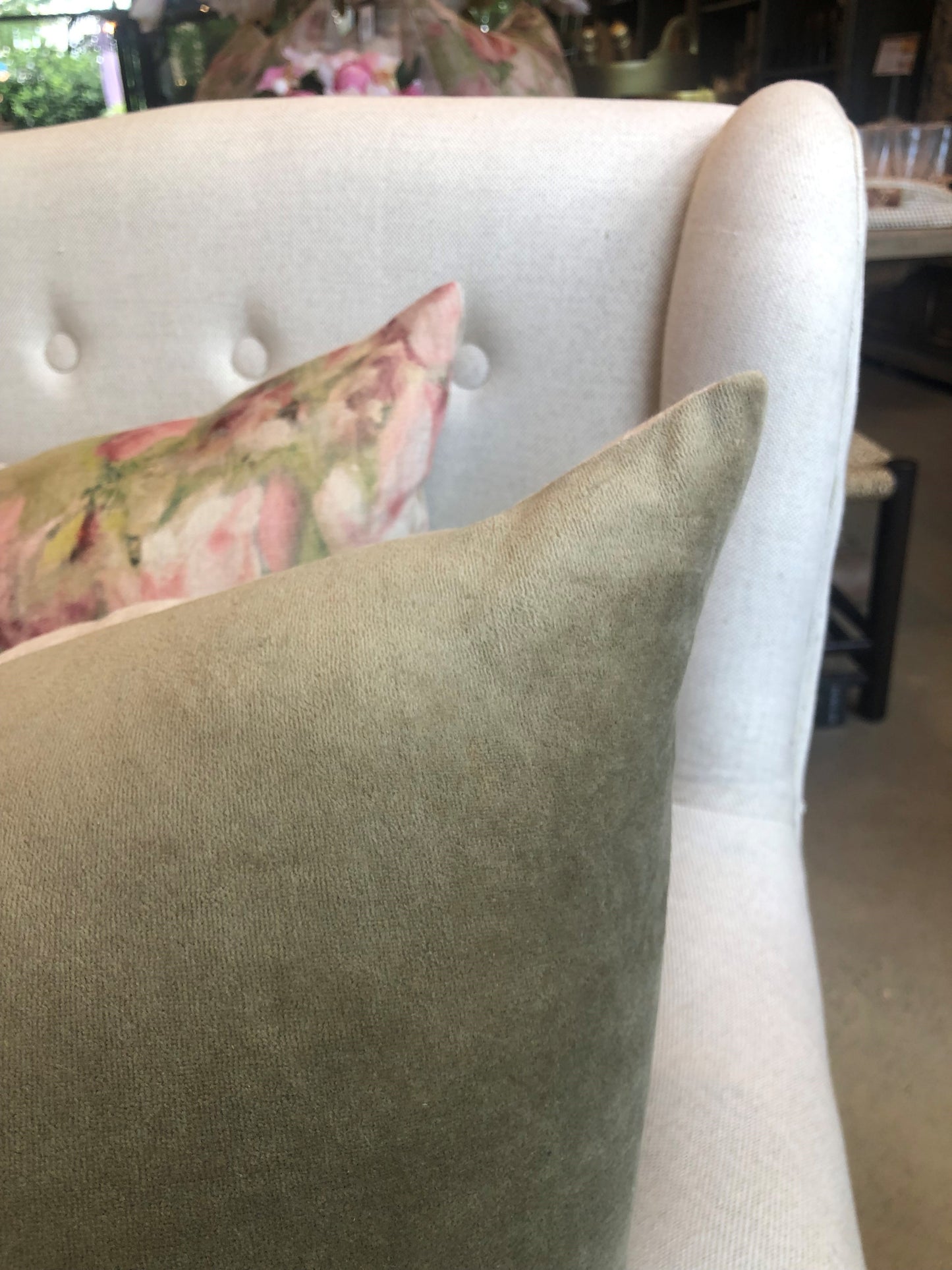 The luxurious Fontainebleau Cotton Velvet & French Linen Reversible Moss Green Cushion& features high quality plain cotton & short pile velvet and natural 100% Flax French Linen on the reverse. Corner close up.