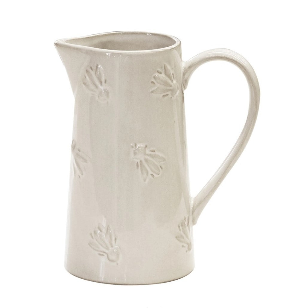 Experience the exquisite design of the Abeille Bee Cream Ceramic Jug, with an embossed bumblebee design and glossy cream-colored glaze. Perfect for holding water or displaying beautiful flowers, this jug adds a touch of elegance to any kitchen. Plus, its large, comfortable handle makes it easy to use.