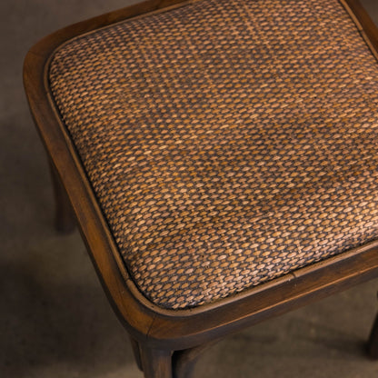 Fashioned with solid teak wood and equipped with a cushioned rattan seat, this graceful stool exhibits a stylish antiqued grey wash finish. Detail