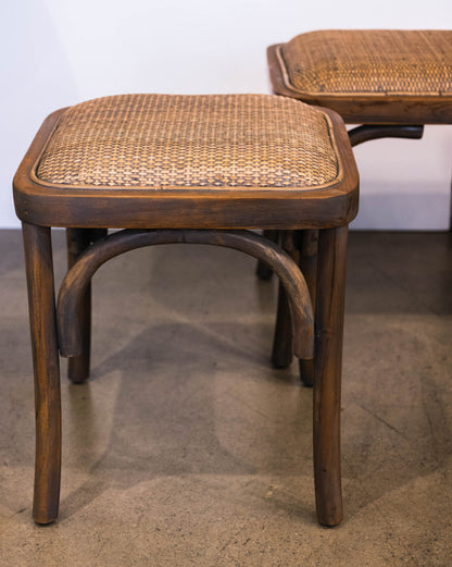 Fashioned with solid teak wood and equipped with a cushioned rattan seat, this graceful stool exhibits a stylish antiqued grey wash finish. Front