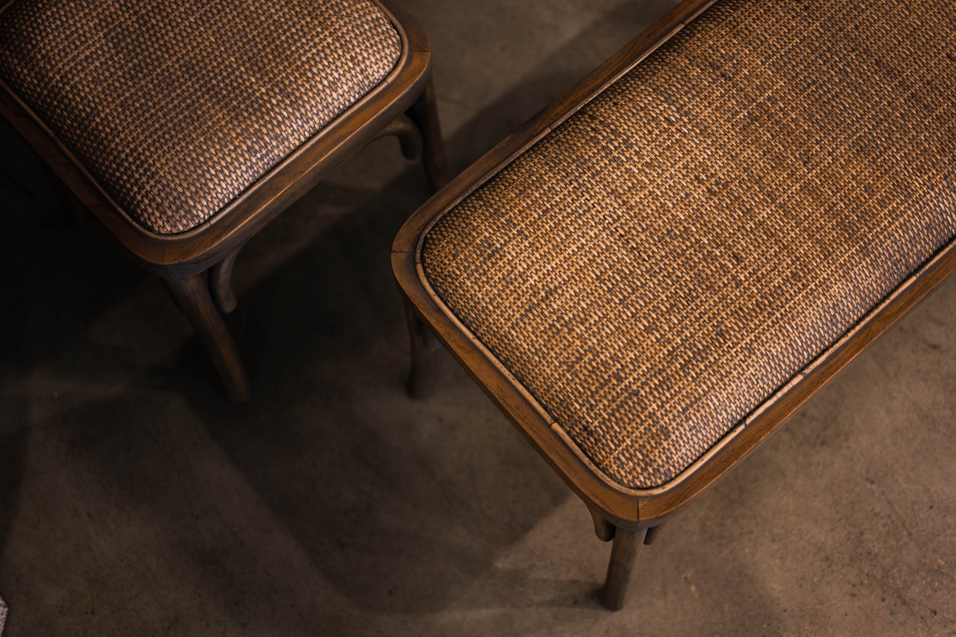 Fashioned with solid teak wood and equipped with a cushioned rattan seat, this graceful bench exhibits a stylish antiqued grey wash finish. Detail