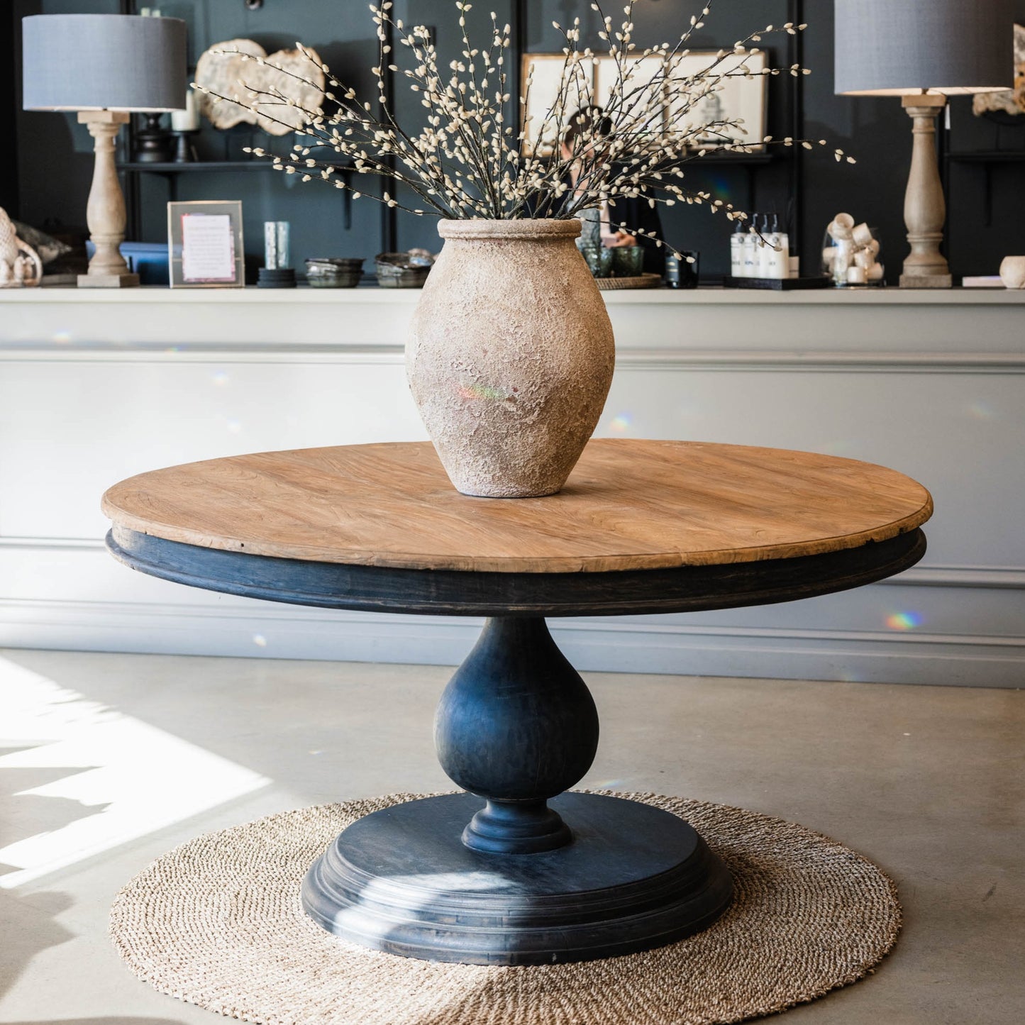 Our Remy Table is crafted from durable teak wood, boasting a round shape that is suitable for both indoor and outdoor use. Its unique carved leg design gives it a timeless, two-toned look that will elevate any space. With its solid construction and classic aesthetic, this round dining table is a perfect choice for those seeking a long-lasting elegant style. Front