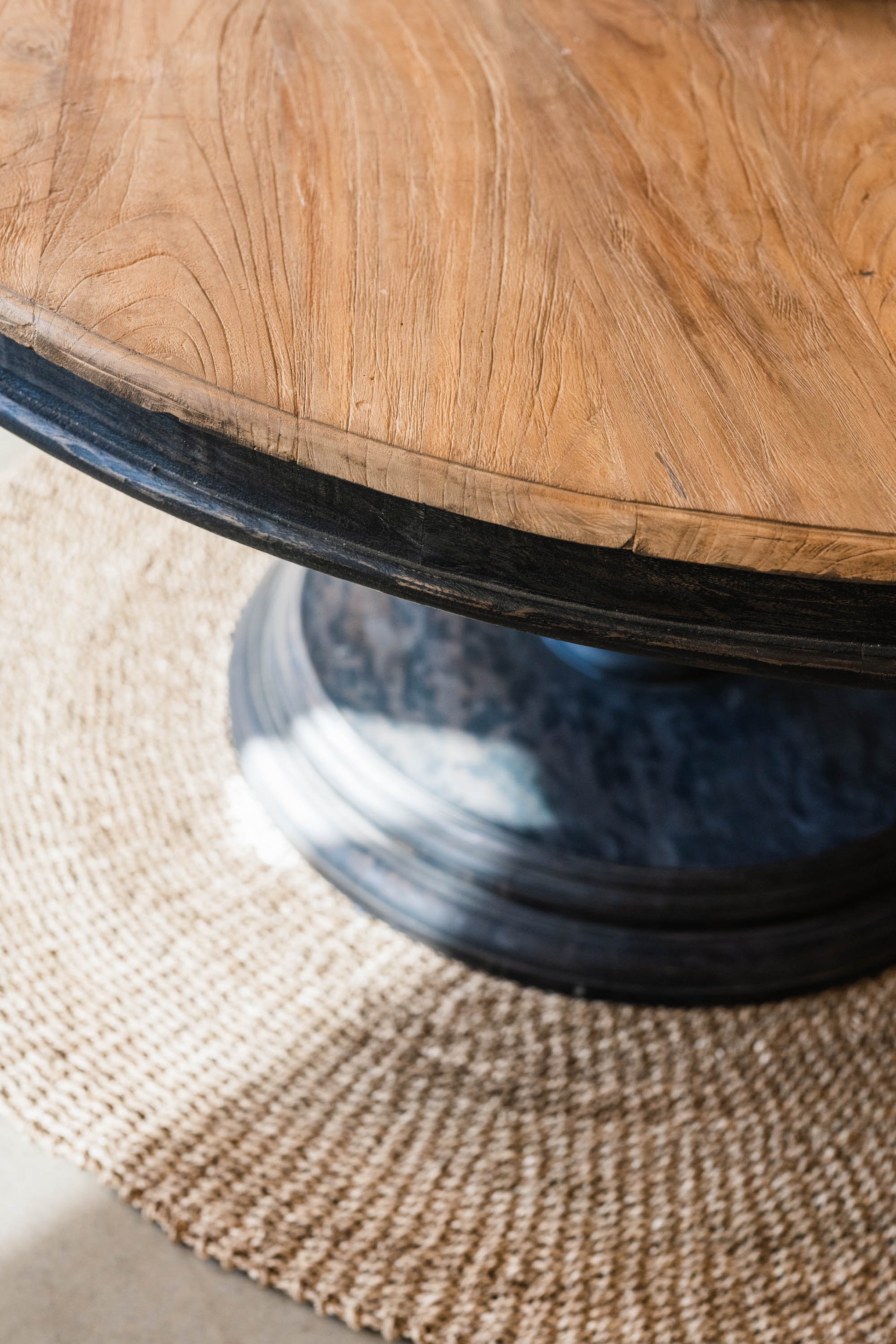 Our Remy Table is crafted from durable teak wood, boasting a round shape that is suitable for both indoor and outdoor use. Its unique carved leg design gives it a timeless, two-toned look that will elevate any space. With its solid construction and classic aesthetic, this round dining table is a perfect choice for those seeking a long-lasting elegant style. Detail