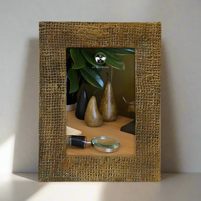 Capture your most cherished memories in style with the Winston Antique Brass Finish Photo Frame. This exquisite frame boasts a timeless sophistication and can be displayed in portrait or landscape orientation for ultimate versatility. Made from high-quality aluminium, this frame features a stunning dimpled antique brass finish that adds a touch of elegance to any room.