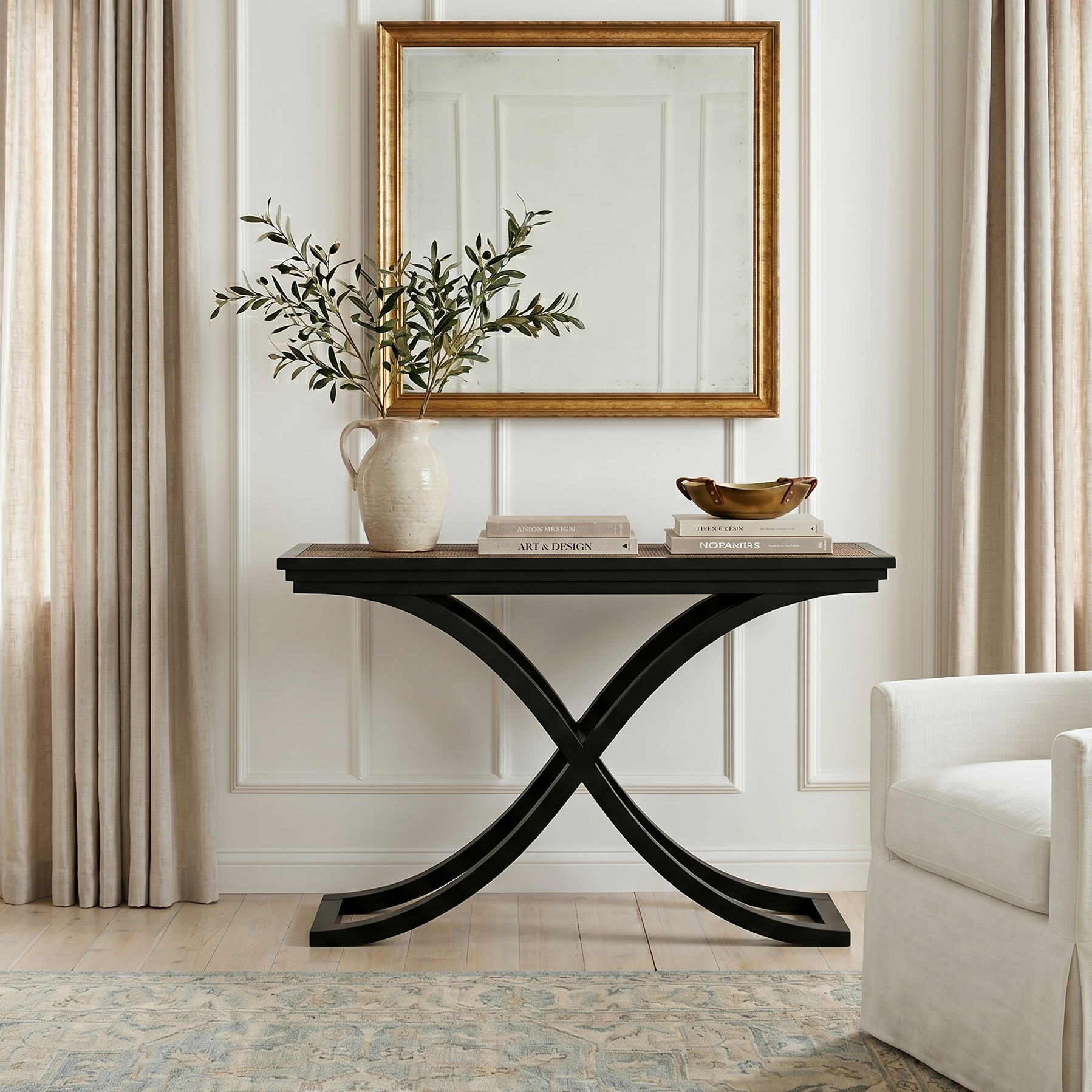 Black console table with decorative items in a living room setting