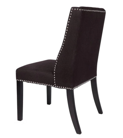 Introduce French-style sophistication to your dining space with the Louis Dining Chair. Boasting soft curves and tailored buttoning, its dark toned wood leg adds elegant formality while its black upholstery adds a contemporary touch. Side