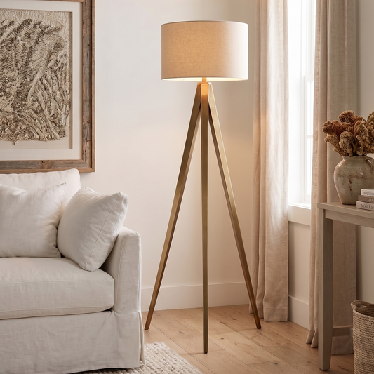 Living room with a tripod floor lamp, sofa, and side table.