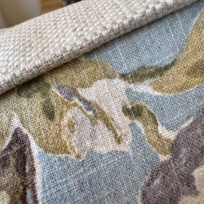 Close-up of a camouflage-patterned rug with a textured border.