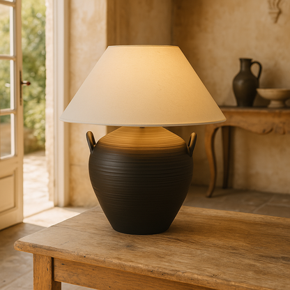 Experience the versatile charm of the Camille Black Table Lamp &amp; Shade, expertly crafted from ceramics. Perfect for any setting, this piece will add a touch of elegance and functionality to your space.

Dimensions: L 46cm W 46cm H 48cm&nbsp;