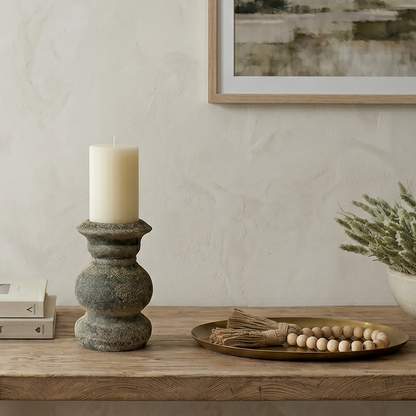 Wooden table with decor items in a room with a neutral color scheme