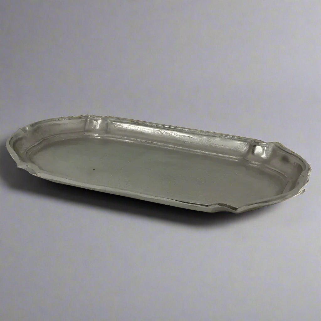 Add a touch of sophistication to your home with the Baroque Tray Large, ideal for showcasing on a coffee table, console, or sideboard. Featuring a captivating baroque-inspired design, this aluminium tray is finished in an elegant aged silver, combining style and practicality effortlessly.
