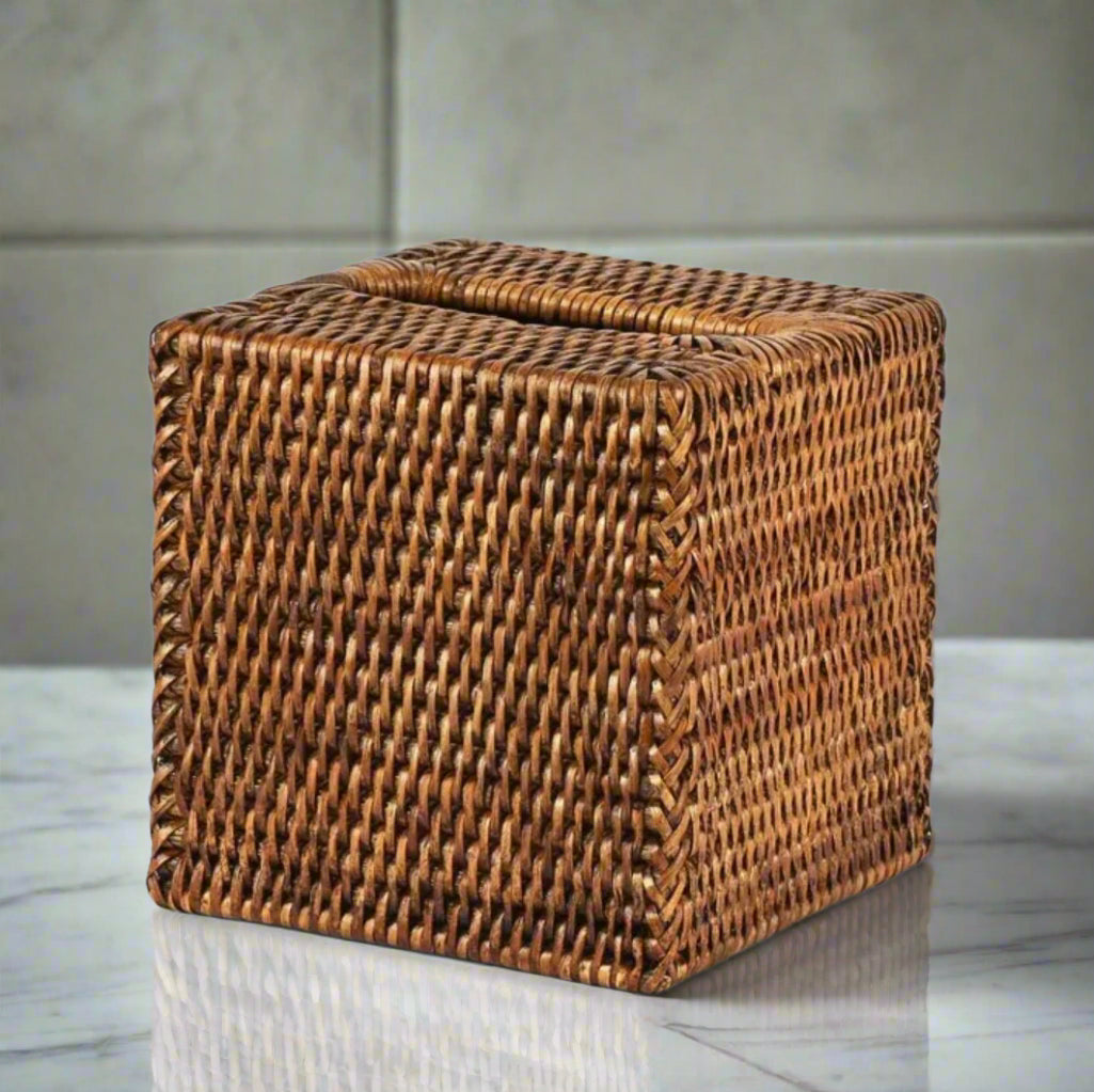 Enhance your bathroom with the warm, rich brown tones of our Square Rattan Tissue Box Cover. Made from durable woven rattan, this cover offers both functionality and a natural, elegant style that complements any decor.