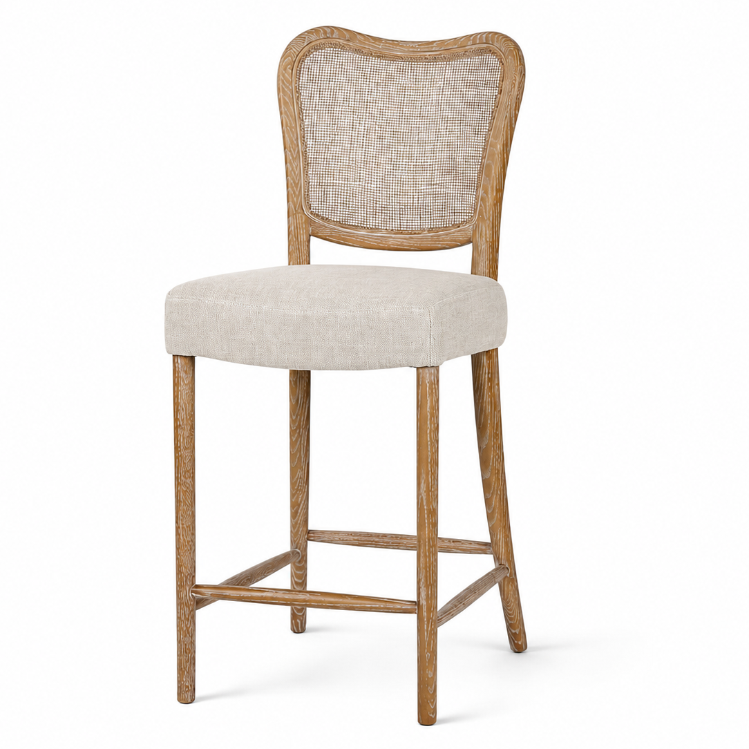 A counter-height bar stool with a light beige textured fabric seat and backrest, supported by a rustic light brown wooden frame and legs, shown against a plain white background.