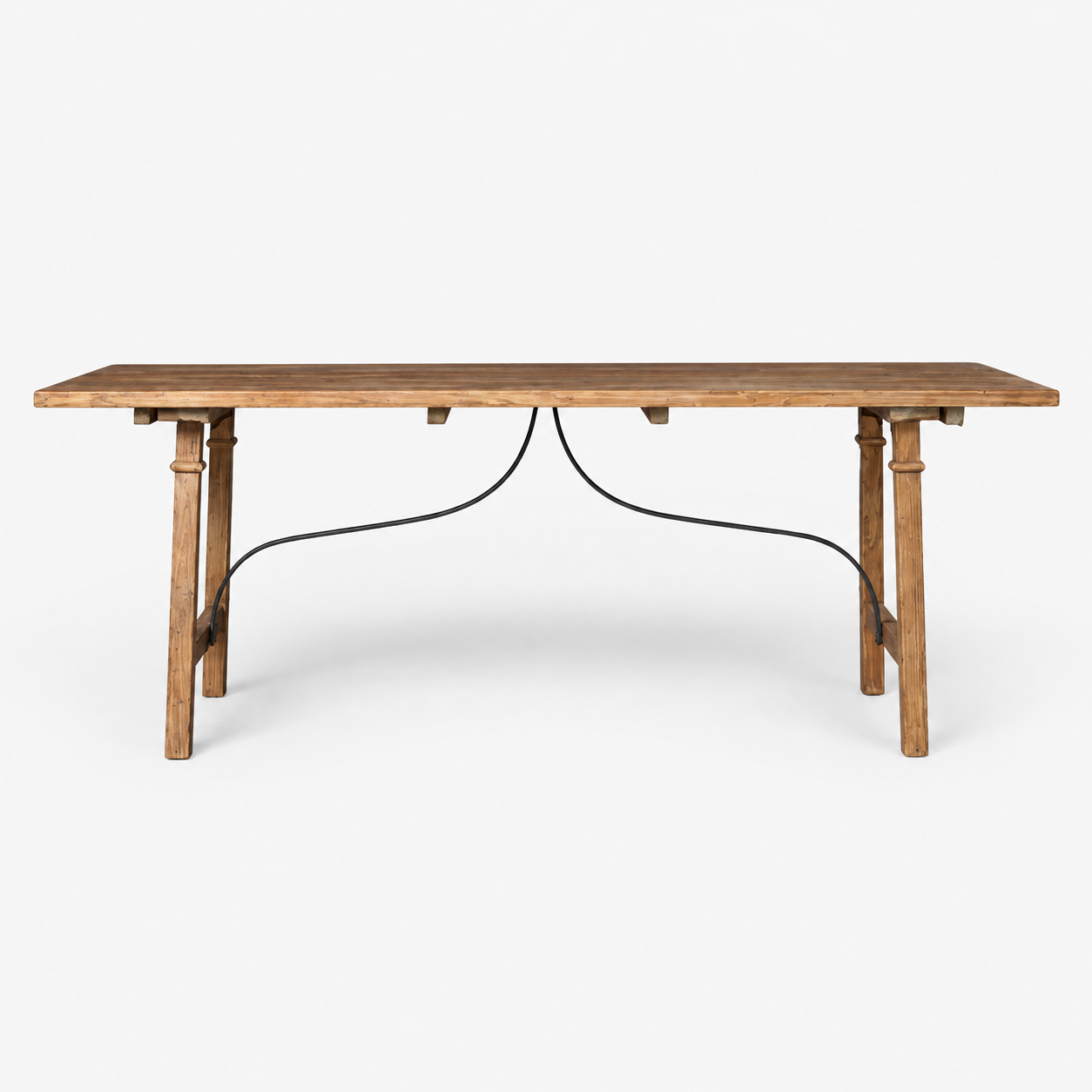 A rustic wooden dining table with a medium brown wood grain finish and a black metal wire apron connecting the legs, shown against a plain white background.