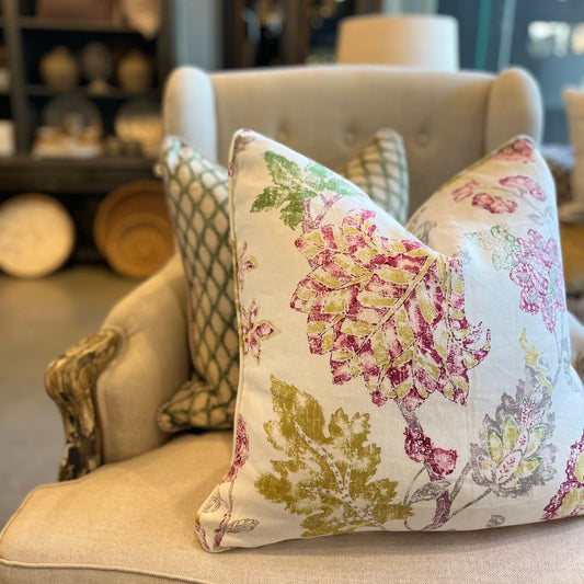 Bring a vibrant burst of color to any space with this beautiful floral print cushion. Featuring shades of raspberry pink, mustard yellow, and green against an ivory background with subtle splashes of grey.

Front Close-up