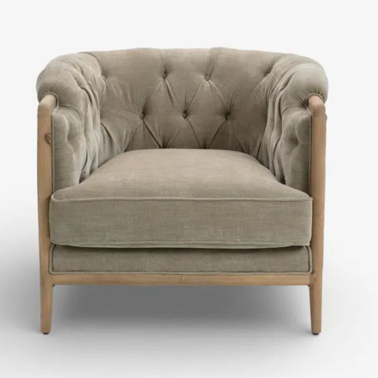Beige armchair with wooden frame on a white background