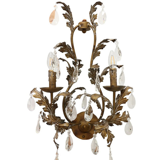 A sophisticated wall sconce with a bronze finish, featuring leaf-like designs and hanging crystals.
