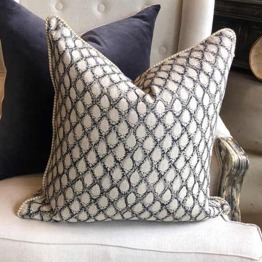 This elegant Cypress Block Printed Linen Black Cushion is hand block printed on soft, natural linen and adorned with delicate piping along the edges. Drawing inspiration from the luxurious textiles of the ancient Orient, it adds a touch of sophistication to any space. Crafted by the renowned Swedish brand, Chamois, this cushion is made with premium Belgian 100% linen and includes a soft feather insert.