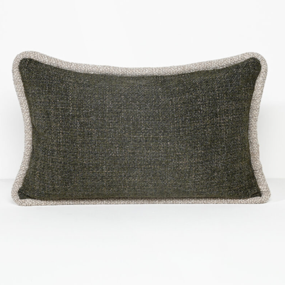A rectangular lumbar throw pillow with a dark charcoal gray textured center and a contrasting light beige bouclé border, shown on a clean white background.
