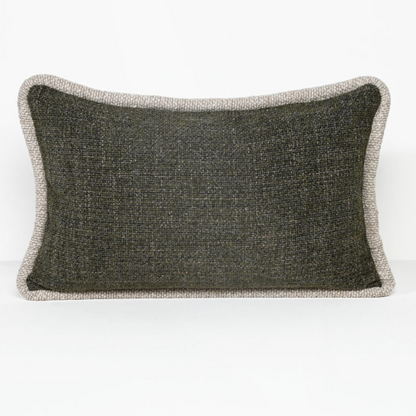 A rectangular lumbar throw pillow with a dark charcoal gray textured center and a contrasting light beige bouclé border, shown on a clean white background.