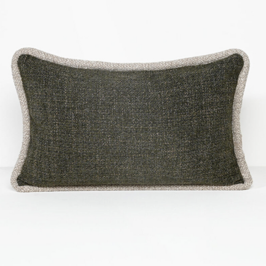 A rectangular lumbar throw pillow with a dark charcoal gray textured center and a contrasting light beige bouclé border, shown on a clean white background.