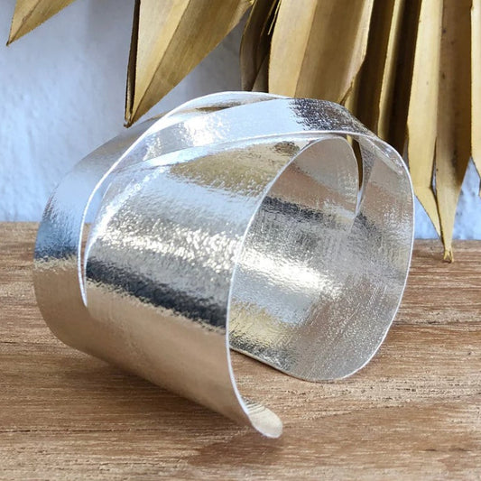 Eris Silver Cuff blends Australian design with Indian craftsmanship, featuring bold architectural lines in brass with refined silver plating. 6cm W x 5cm H.