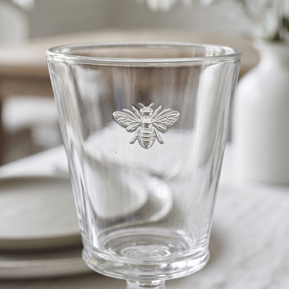 Clear glass with bee design on a table setting