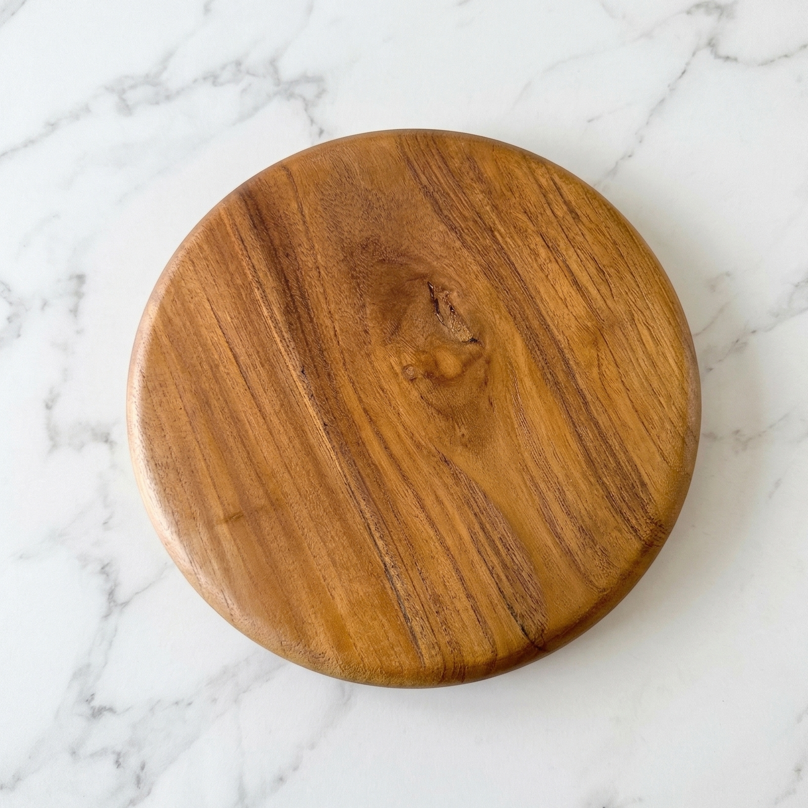 Wooden pedestal on a marble surface