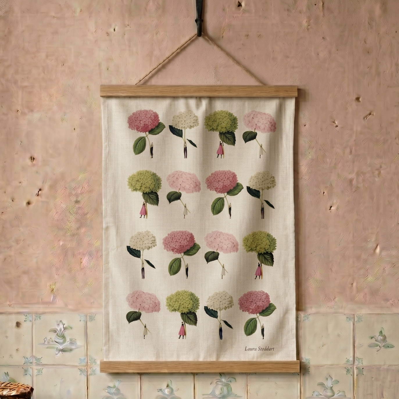 Floral patterned tea towel hanging on a distressed wall with tiled floor.