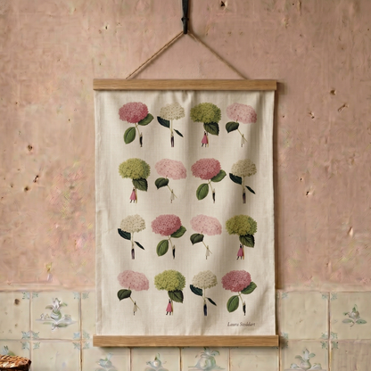 Floral patterned tea towel hanging on a distressed wall with tiled floor.