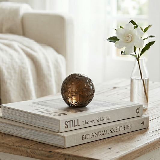 Cozy living room with a wooden coffee table featuring books and a decorative object.