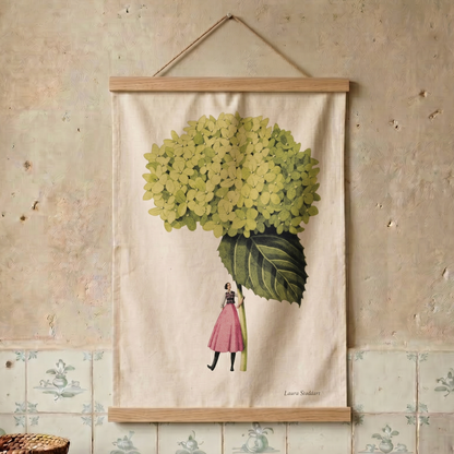 Decorative tea towel with a floral design on a textured wall.